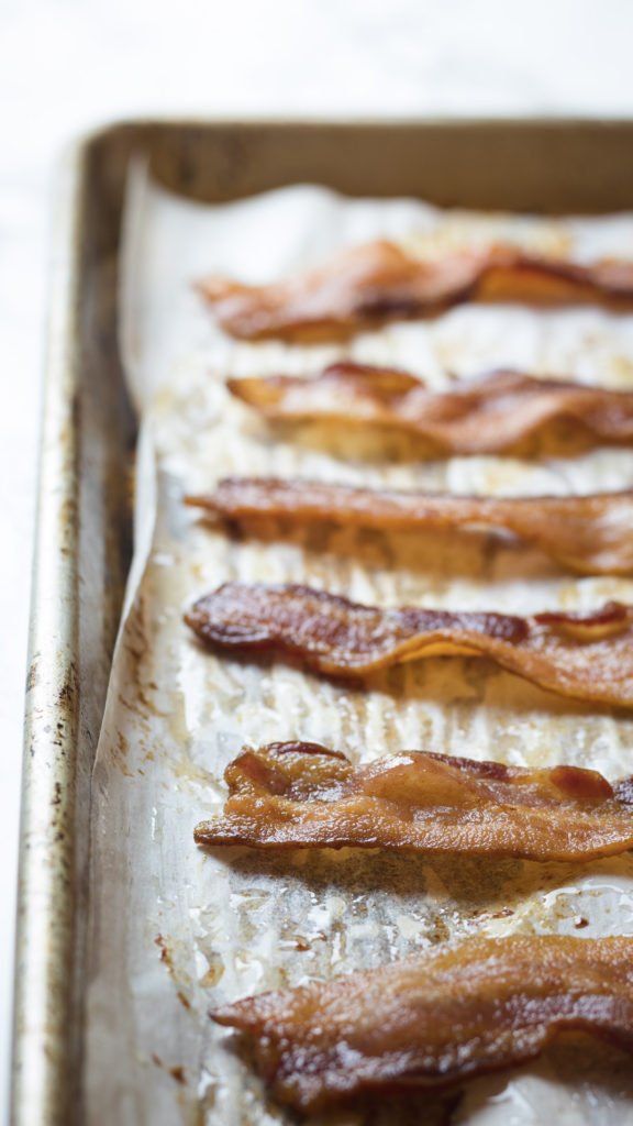 Baked bacon on baking sheet