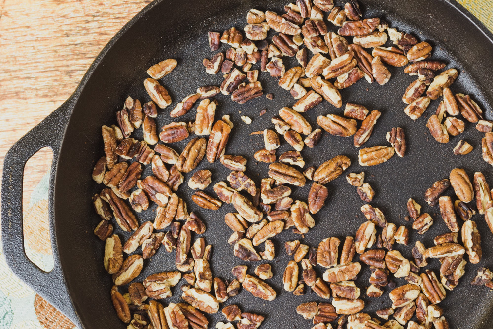 Pecans roasted in cast iron man.