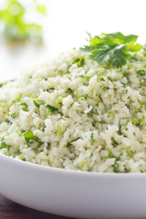 Cilantro Line Cauliflower Rice piled high in a white bowl