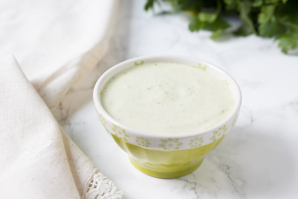 Herb filled ranch dressing in a bowl
