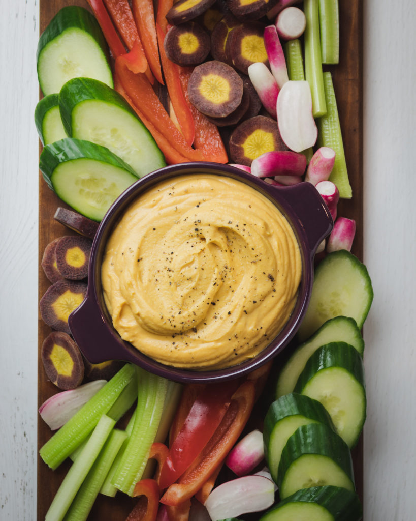 Sweet Potato Hummus on a colorful veggie platter.