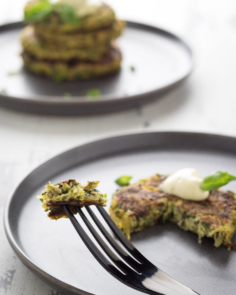 Zucchini and Potato pancake with a bite ready to eat from a fork