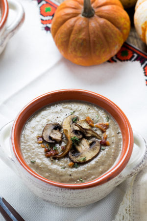 Creamy mushroom soup topped with crispy mushrooms and bacon bits.