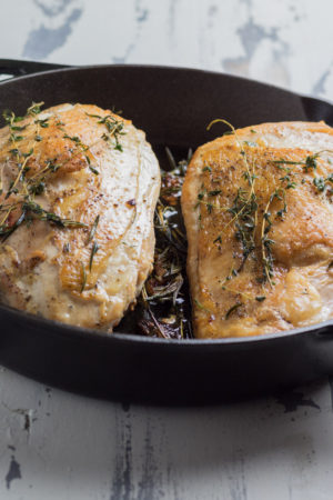 Herb roasted turkey breasts cooked in a cast iron pan