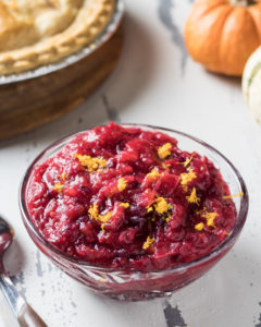 Instant pot cranberry sauce in a bowl topped with orange zest