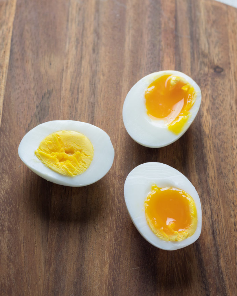 Soft and hard boiled eggs cut in half